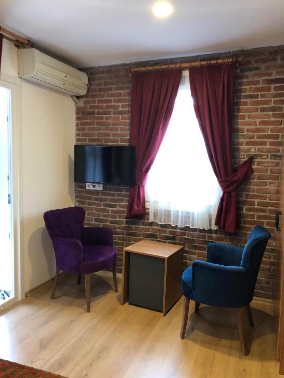 TV a/nebo společenská místnost v ubytování Masal Hotel