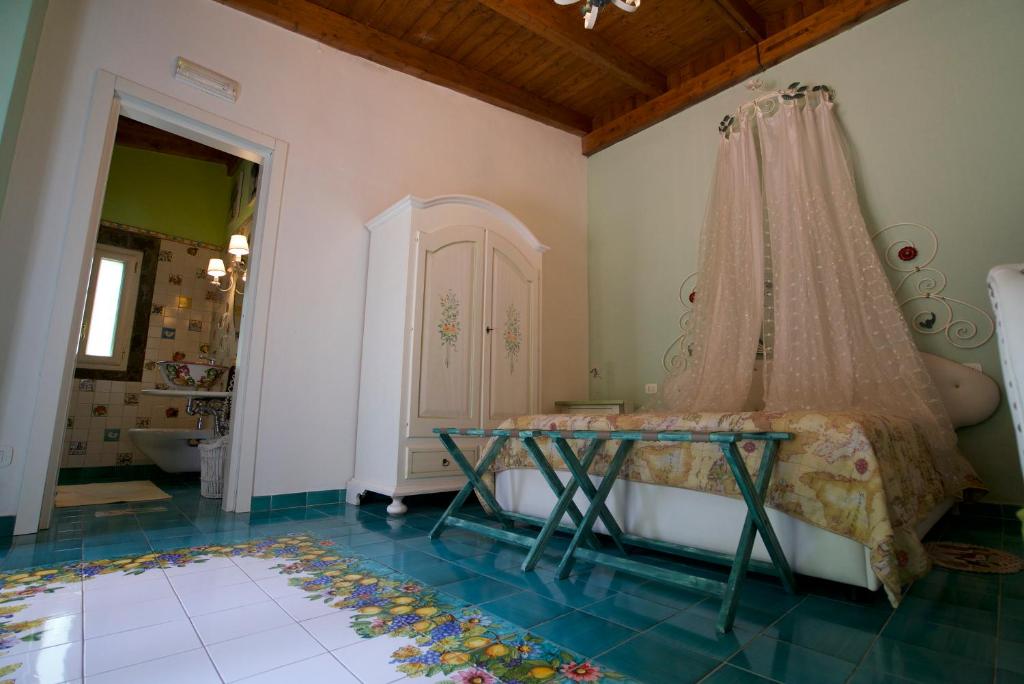 Postel nebo postele na pokoji v ubytování La Dimora le Fumarole Rooms