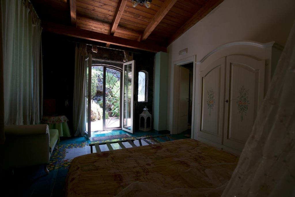 Postel nebo postele na pokoji v ubytování La Dimora le Fumarole Rooms
