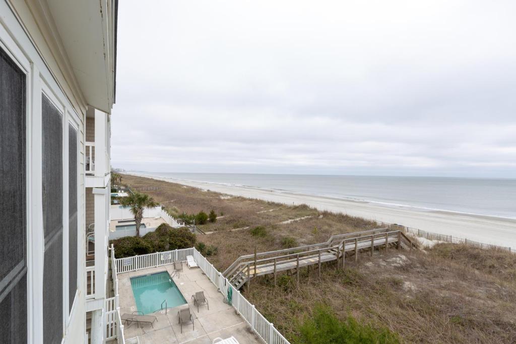 a view of the beach from the balcony of a beach house at A Place at the Beach by Capital Vacations in Myrtle Beach