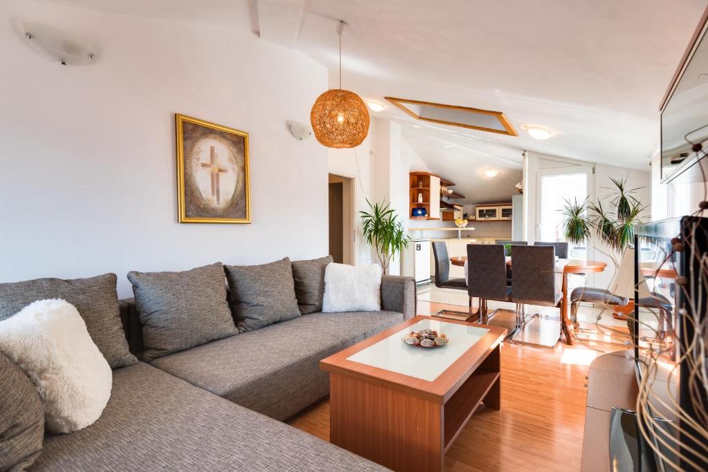 a living room with a couch and a table at Apartment Saint Michael in Šibenik