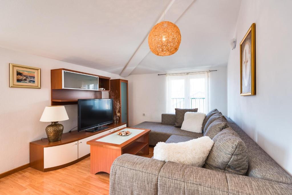 Televízia a/alebo spoločenská miestnosť v ubytovaní Apartment Saint Michael