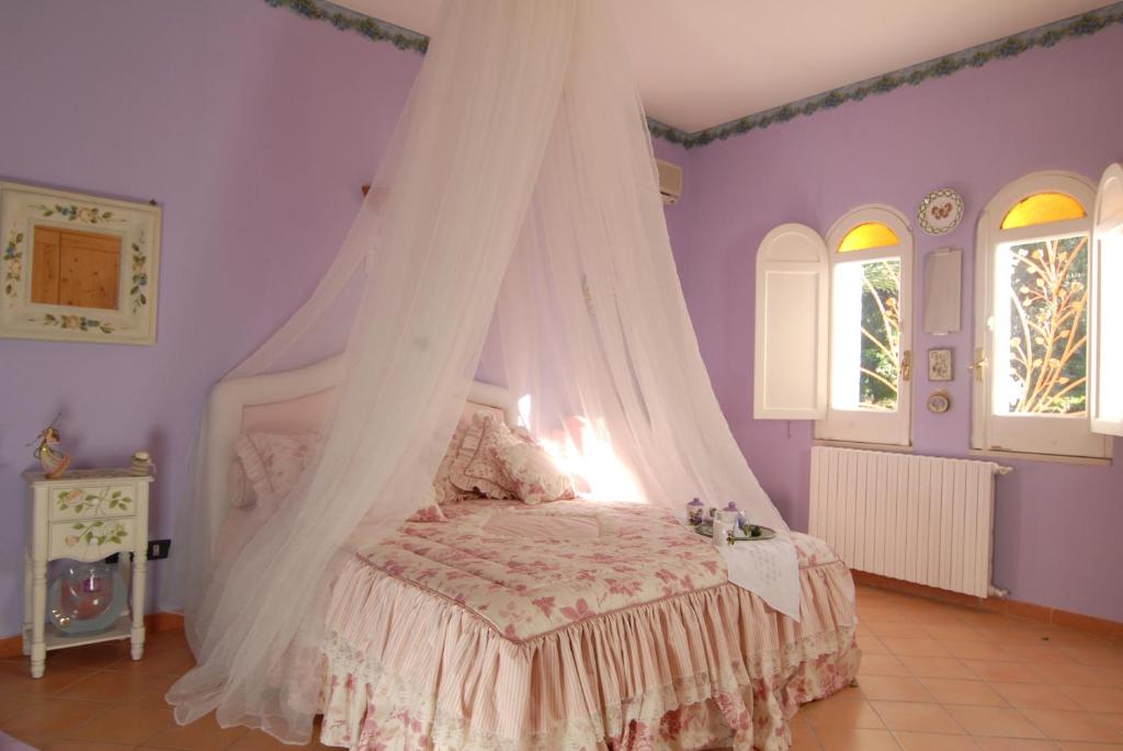 Postel nebo postele na pokoji v ubytování La Dimora le Fumarole Rooms