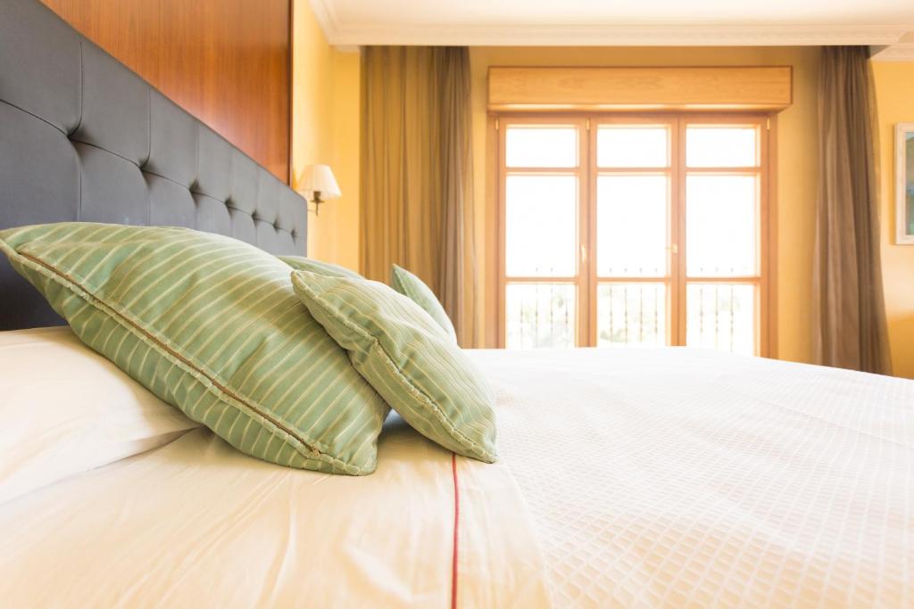 Postel nebo postele na pokoji v ubytování Hotel Torremilanos