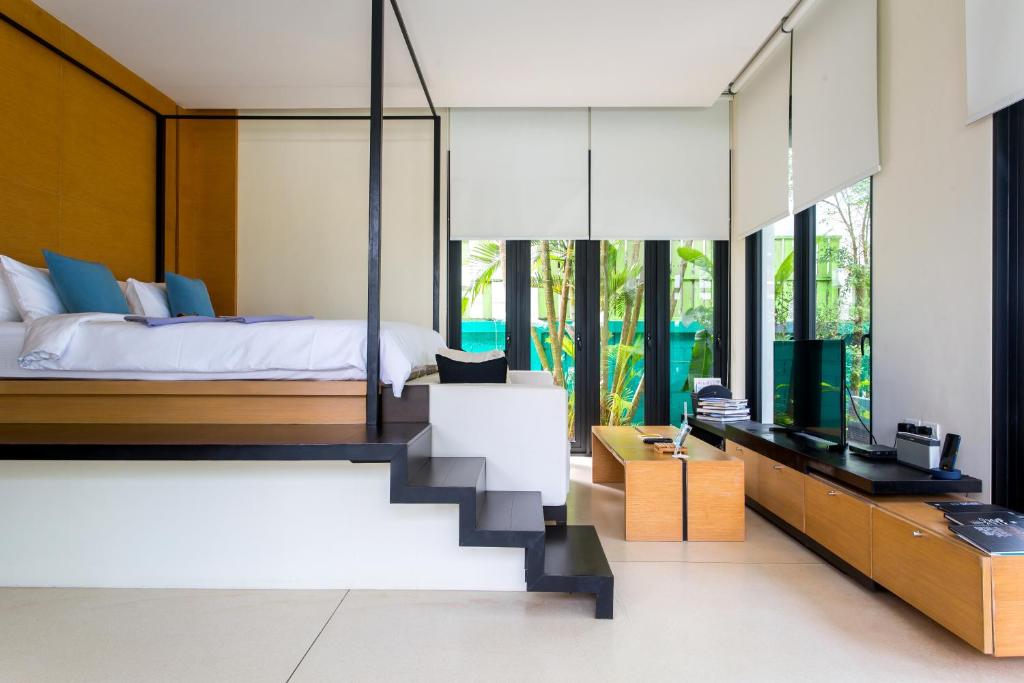 Postel nebo postele na pokoji v ubytování The Anda Mani Khaolak Beachfront Villas