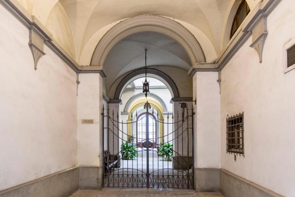 an entrance to a building with a wrought iron gate at B&B Stupido Hotel in Florence
