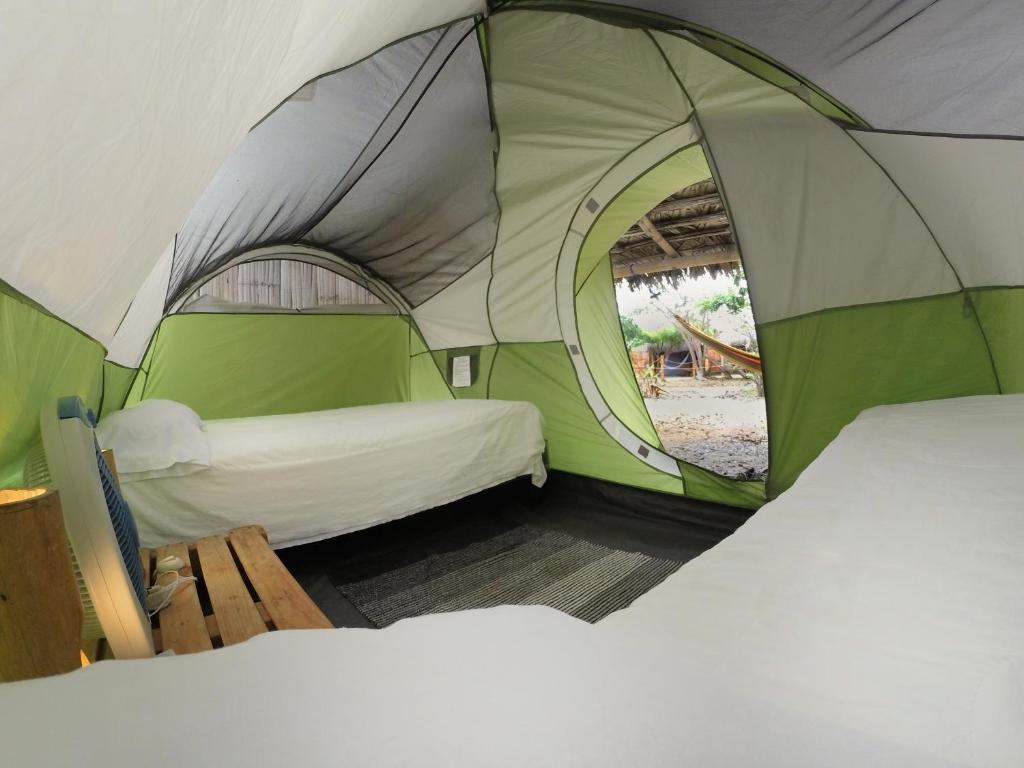 Postel nebo postele na pokoji v ubytování Cabalonga EcoAdventure