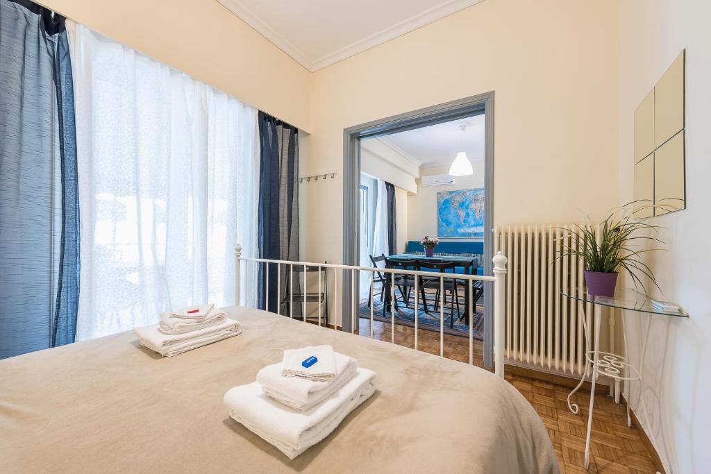 Posteľ alebo postele v izbe v ubytovaní My Athens Gem