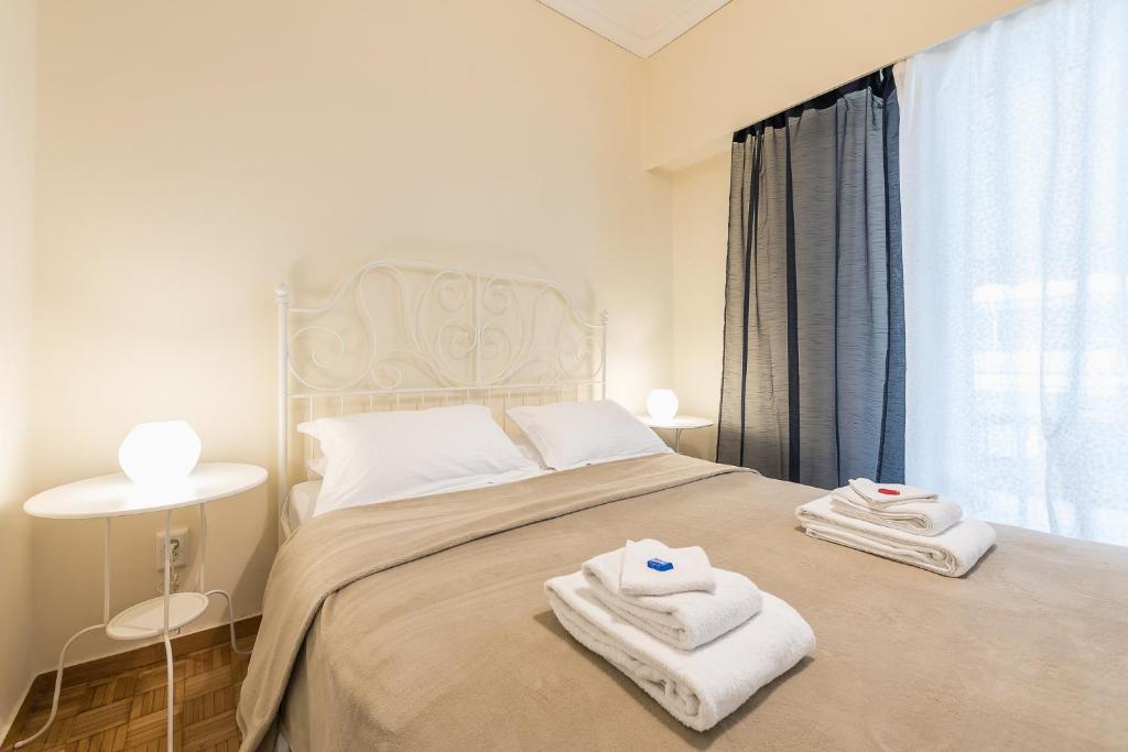 Posteľ alebo postele v izbe v ubytovaní My Athens Gem