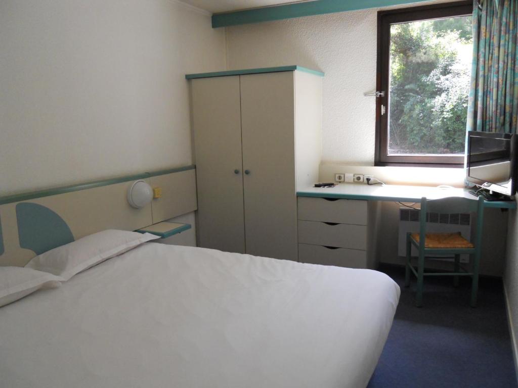 Postel nebo postele na pokoji v ubytování Hotel Inn Design Moutiers