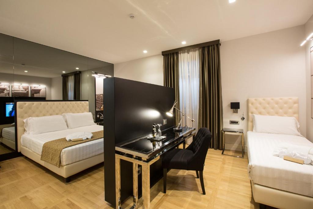 Postel nebo postele na pokoji v ubytování Floris Hotel