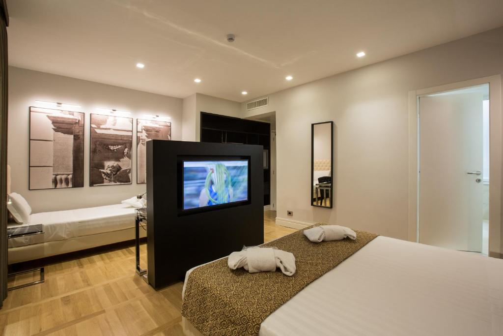 Postel nebo postele na pokoji v ubytování Floris Hotel