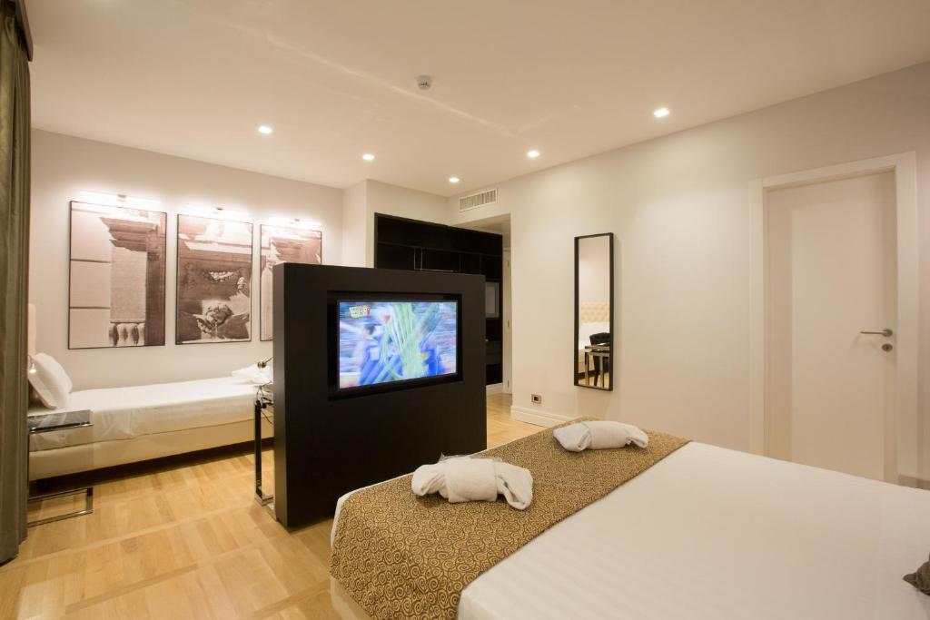 Postel nebo postele na pokoji v ubytování Floris Hotel