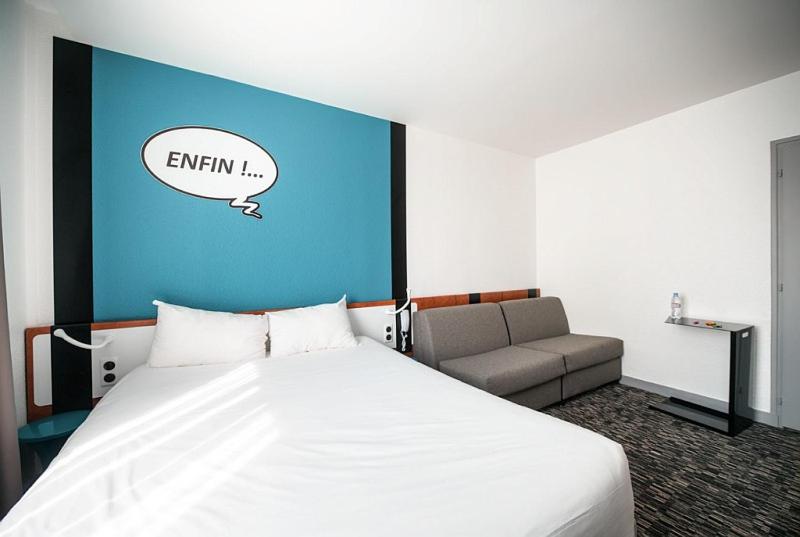 Postel nebo postele na pokoji v ubytování Ibis Styles Chambery Centre Gare