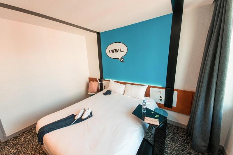 Postel nebo postele na pokoji v ubytování Ibis Styles Chambery Centre Gare