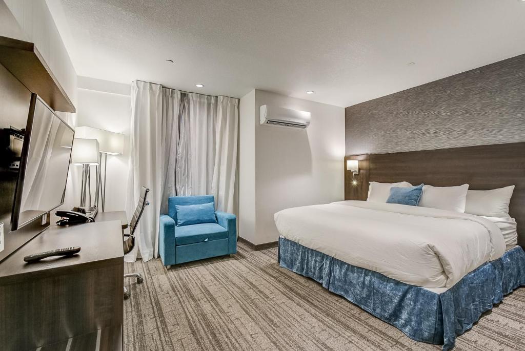 Postel nebo postele na pokoji v ubytování EST Hotel
