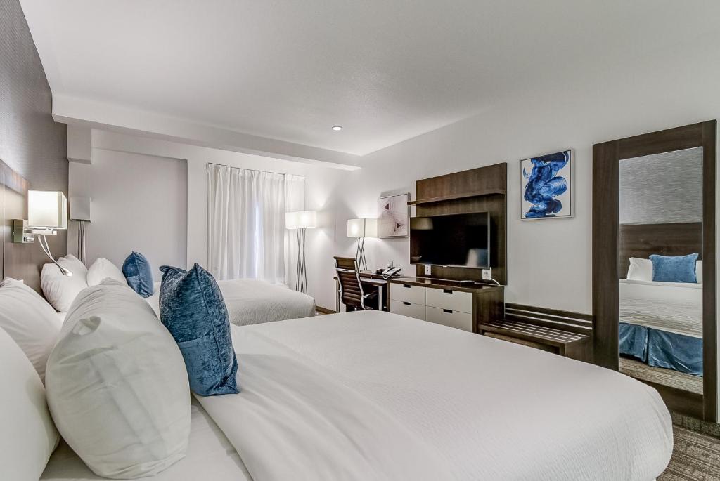 Postel nebo postele na pokoji v ubytování EST Hotel