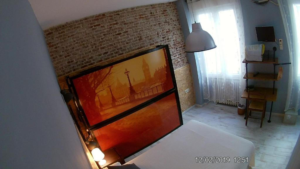 Postel nebo postele na pokoji v ubytování Hostal Hispalense
