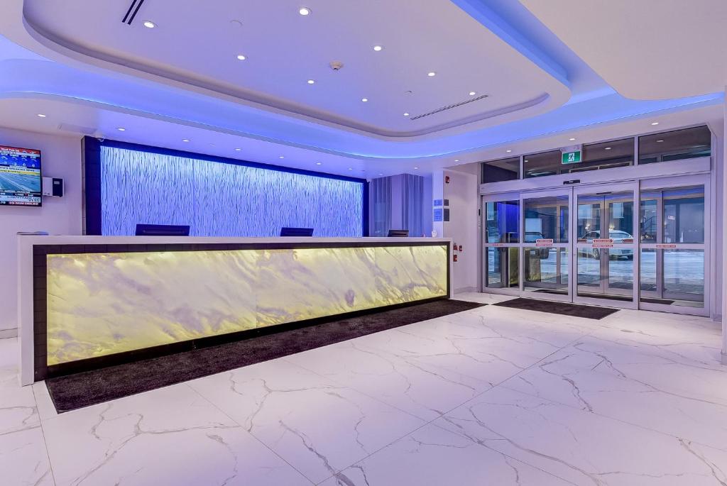 a large aquarium in a room with a large window at EST Hotel in Toronto