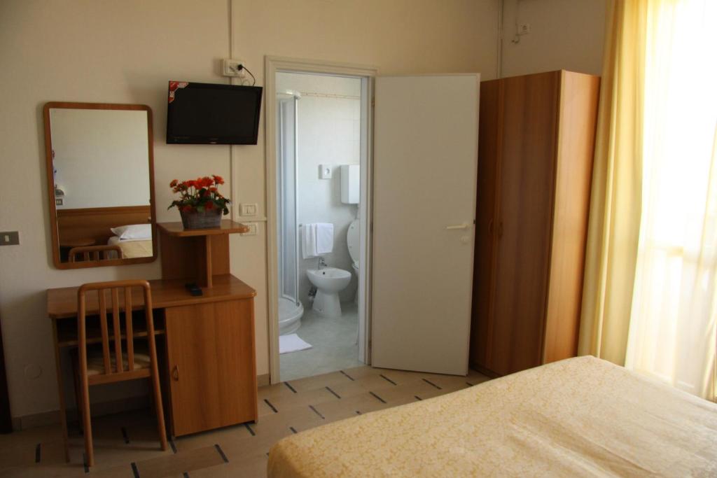 Postel nebo postele na pokoji v ubytování Hotel Zani