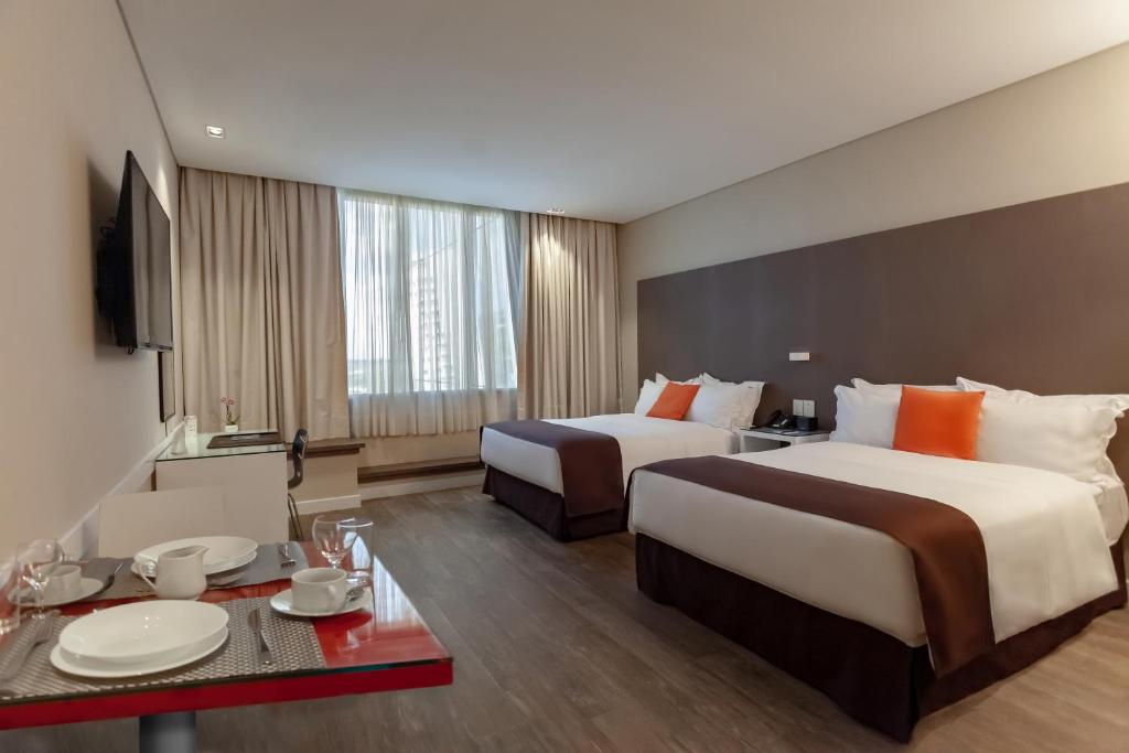 Postel nebo postele na pokoji v ubytování Paseo La Galería Hotel & Suites