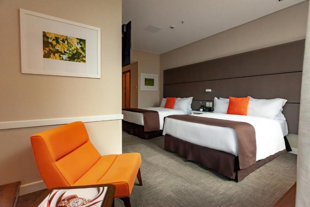 Postel nebo postele na pokoji v ubytování Paseo La Galería Hotel & Suites