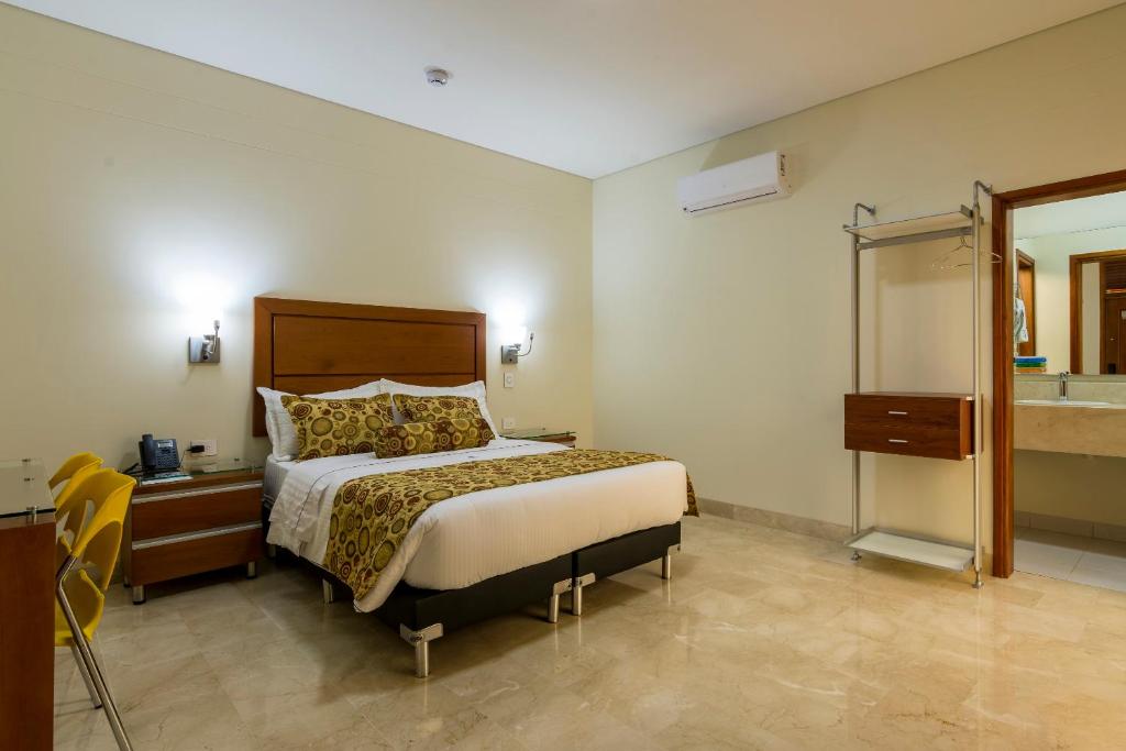 Postel nebo postele na pokoji v ubytování Hotel Dorado La 70
