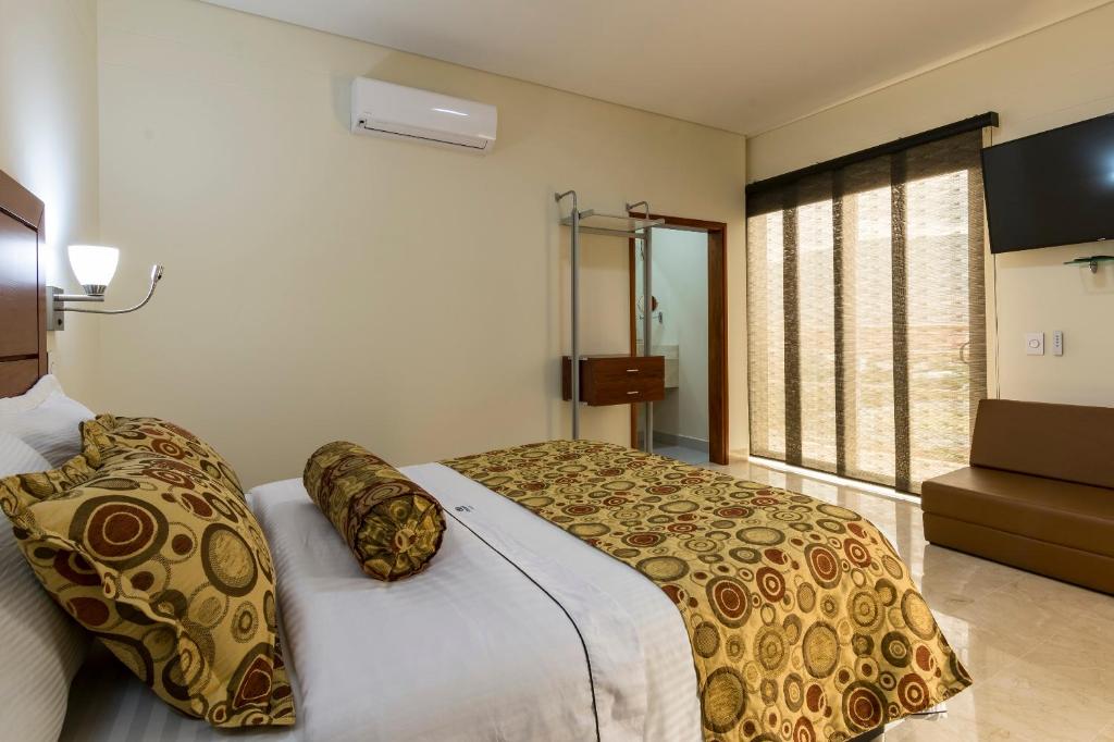 Postel nebo postele na pokoji v ubytování Hotel Dorado La 70