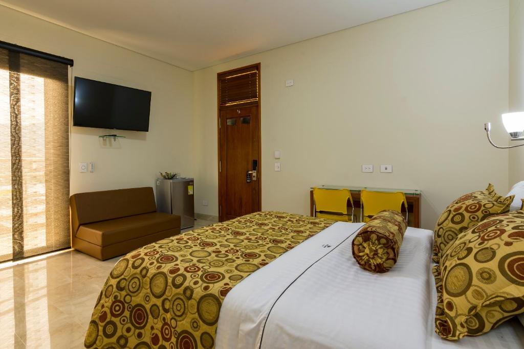 Postel nebo postele na pokoji v ubytování Hotel Dorado La 70