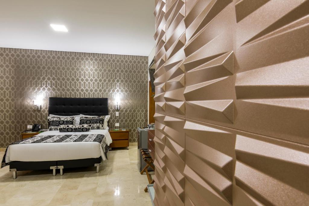 Postel nebo postele na pokoji v ubytování Hotel Dorado La 70