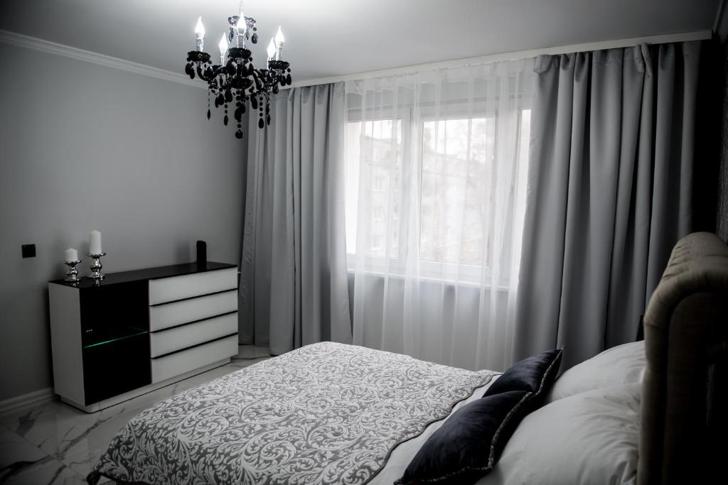 Łóżko lub łóżka w pokoju w obiekcie Glamour Apartments