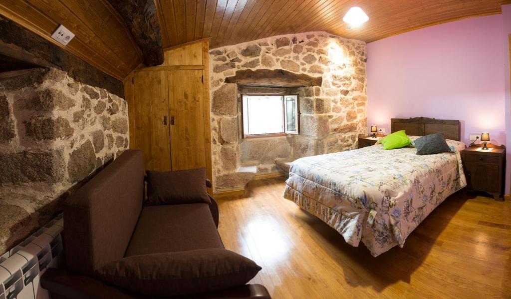 Postel nebo postele na pokoji v ubytování Casa Dos Fuelles