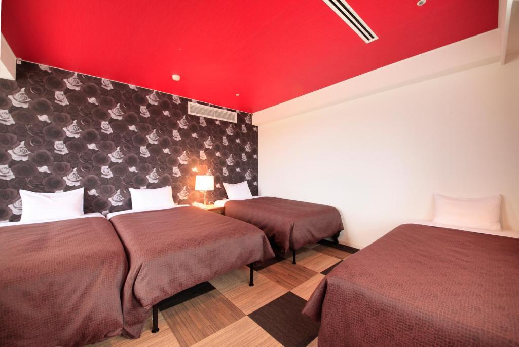 Postel nebo postele na pokoji v ubytování Quintessa Hotel Iseshima