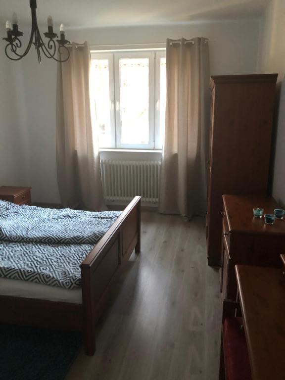 Postel nebo postele na pokoji v ubytování MoMi Apartament Blonia Szczecin Herbowa