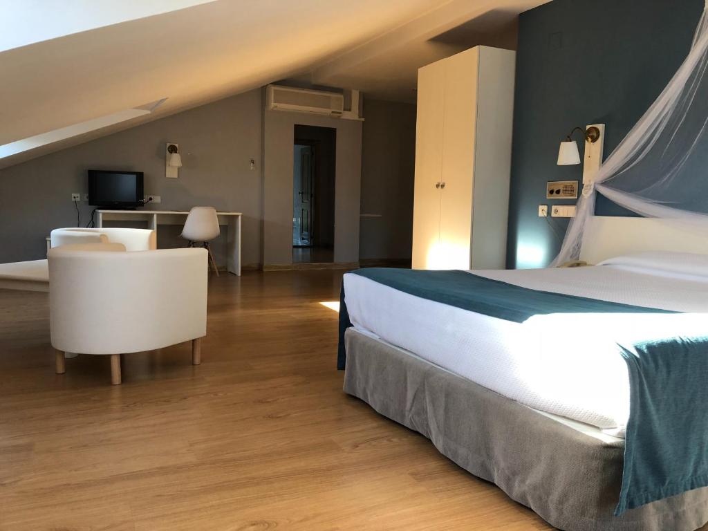 Postel nebo postele na pokoji v ubytování Hotel Jakue