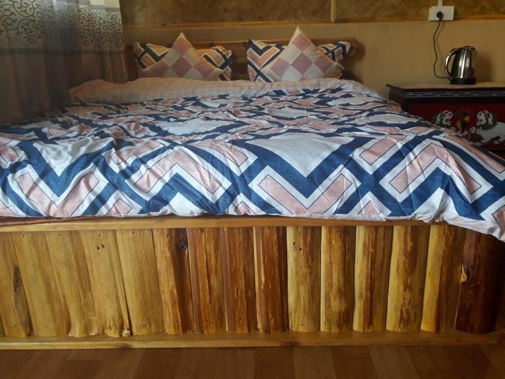Postel nebo postele na pokoji v ubytování Vamoose Soshing Homestay