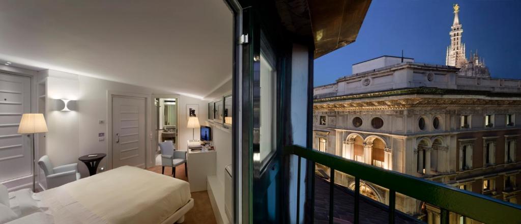 a balcony with a view of the eiffel tower at Maison Milano | UNA Esperienze in Milan