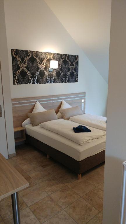Ein Bett oder Betten in einem Zimmer der Unterkunft ST Michael Atrona GmbH
