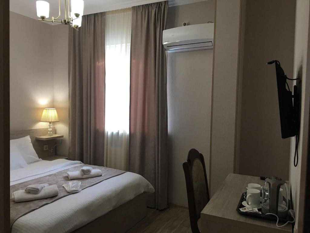 Postel nebo postele na pokoji v ubytování Family Hotel Triston