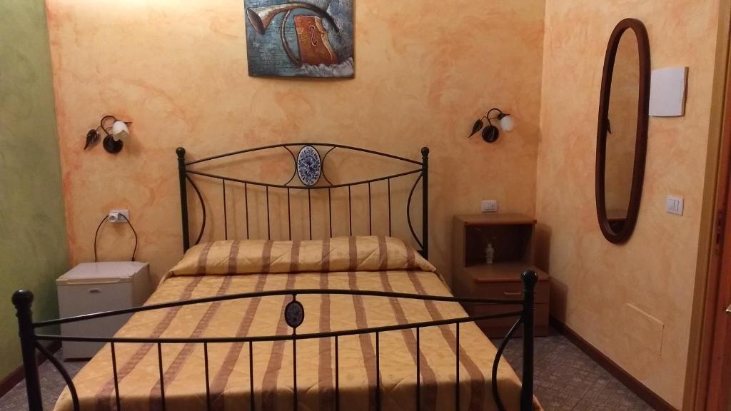 Postel nebo postele na pokoji v ubytování Palazzo Aprile