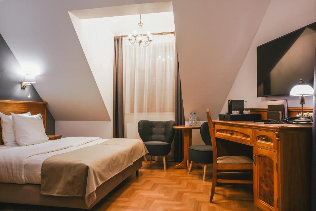 Postel nebo postele na pokoji v ubytování Hotel & Apartments Ventus Rosa