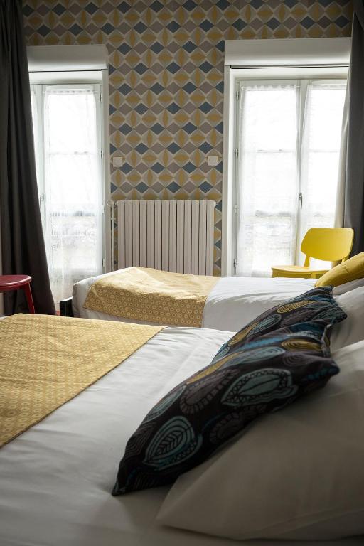 Un ou plusieurs lits dans un h&eacute;bergement de l&#39;&eacute;tablissement Hotel de Paris