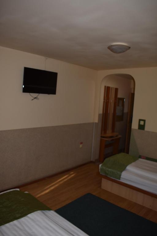 Postel nebo postele na pokoji v ubytování Hotel Zimbru