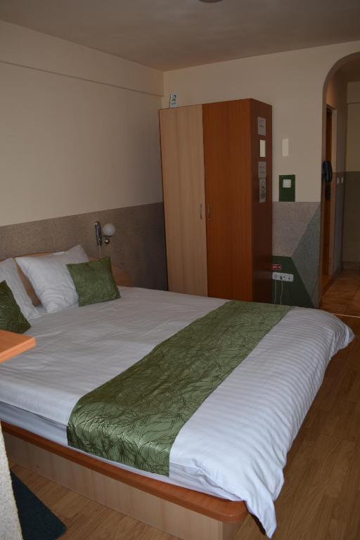 Postel nebo postele na pokoji v ubytování Hotel Zimbru