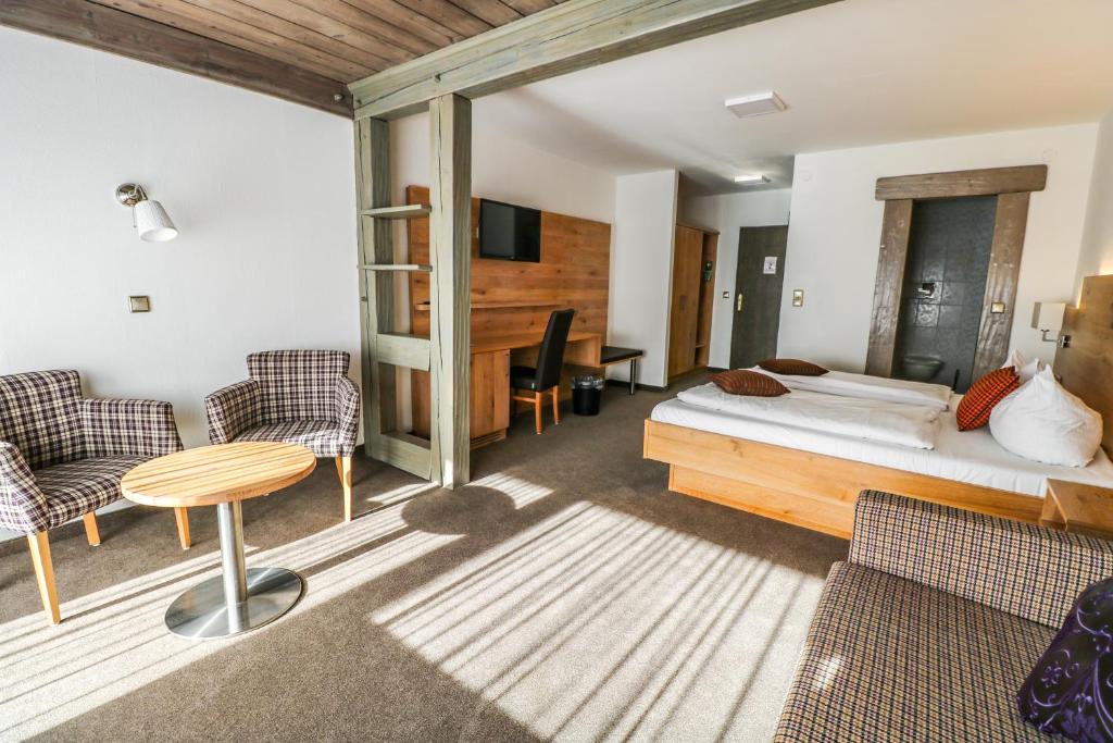 Postel nebo postele na pokoji v ubytování Hotel Quellenhof