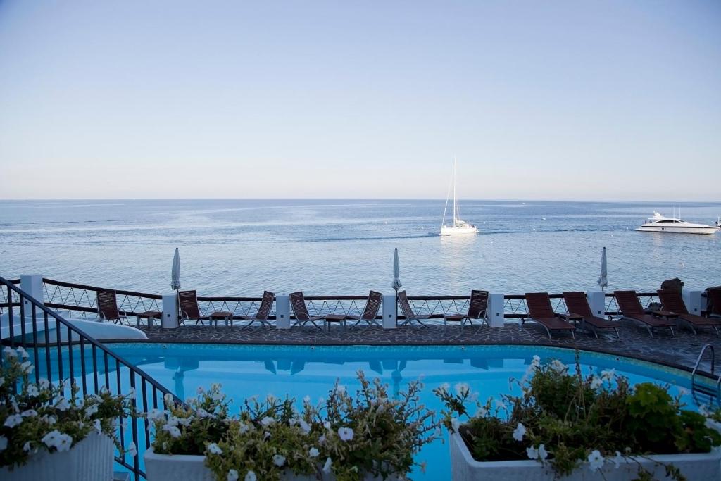 a large body of water with a cruise ship in the distance at Hotel Cincotta in Panarea