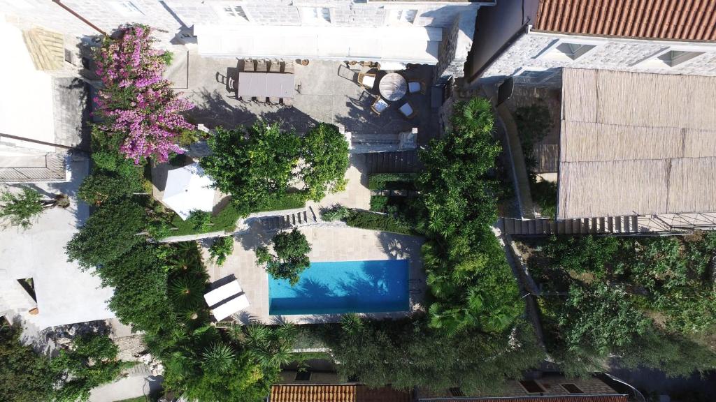 an overhead view of a pool in a yard with trees at Luxury Villa Lemonia near Dubrovnik Heated Pool & Sea View in Trsteno