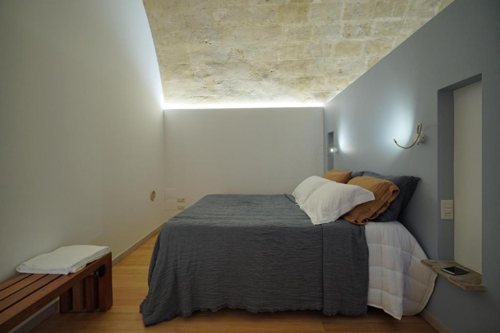 Postel nebo postele na pokoji v ubytování Il Carrubo residenza Walk&Stay