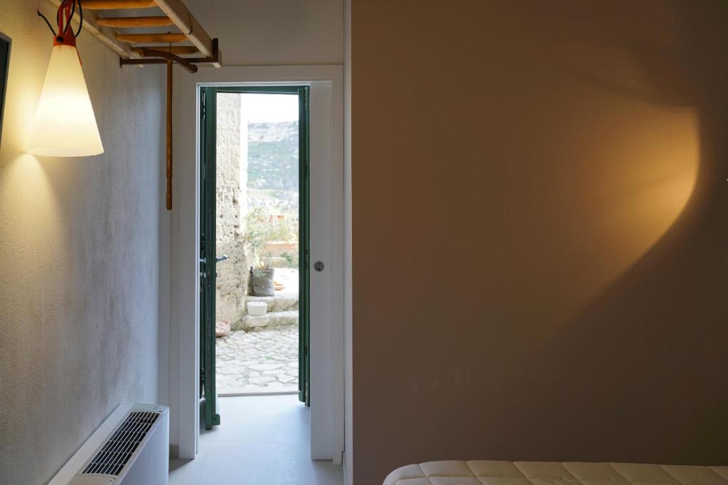 Postel nebo postele na pokoji v ubytování Il Carrubo residenza Walk&Stay
