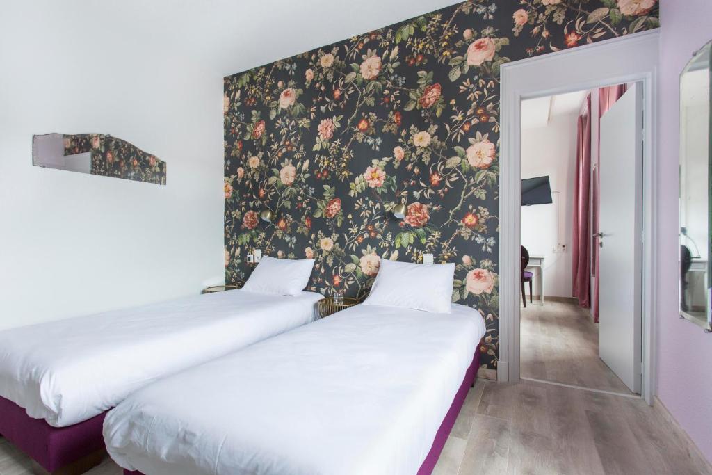 Postel nebo postele na pokoji v ubytování Hôtel d'Angleterre